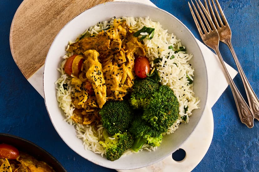 Giving chicken breasts the tandoori treatment, with a simple curried yogurt coating and a scorch under the grill, really elevates this korma. Stirred into a lightly spiced sauce that’s packed with sautéed onions and sweet baby tomatoes and served on a bed of spinach rice, all that’s left to do is sprinkle over a handful of aromatic nigella seeds and grab your fork.
