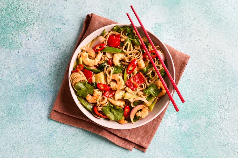 Wok and roll with this quick and utterly delicious stir-fry! Blackened prawns, pak choi, onion, pepper and mangetout are coated in a zingy combo of coriander, chilli, lime and oyster sauce, then served with heaps of filling noodles – and it’s all on the table in 25 minutes.