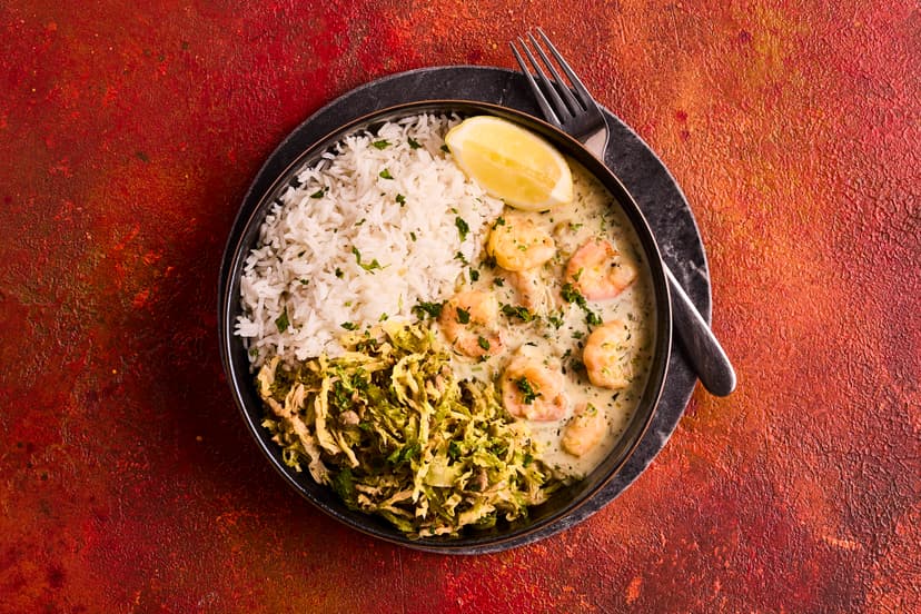 There’s a Scandi vibe to this speedy dish, perfect for a midweek meal. Plump prawns are bathed in a creamy yogurt, garlic and lemon sauce, served with savoy cabbage cooked with piquant capers, and rice to soak up that garlicky gorgeousness.