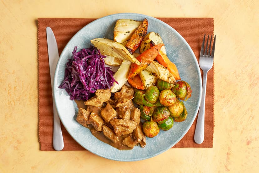 Forget chestnuts roasting on an open fire, we want tasty chick’n chunks simmering in a punchy herb, balsamic and sun-dried tomato-infused gravy!  Served up with roasted spuds, ’snips and carrots sprinkled with thyme, Christmassy red cabbage and smoky paprika sprouts, THIS is how vegetarians do the Big Day.