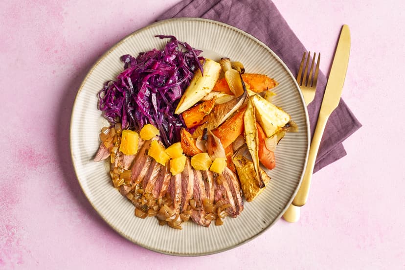 Step aside, turkey. There’s a new festive centrepiece in town. Duck breasts are drizzled with a herby, balsamic onion gravy, dished up with roasted carrots and parsnips tossed in orange zest, thyme, garlic, ginger and nutmeg, plus festive red cabbage and a scattering of diced orange.