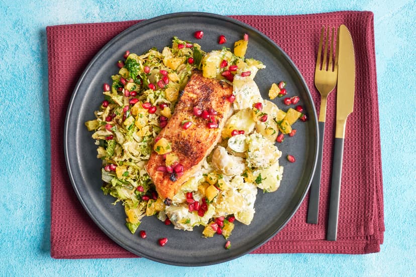 Forget the halls, we’re decking our plates! Grilled salmon fillets get the mulled treatment with orange zest and allspice and are served with crushed dill-flecked baby potatoes, plus a sauté of shredded cabbage, sprouts and spring onions. A flourish of juicy orange and pomegranate brings the sparkle.